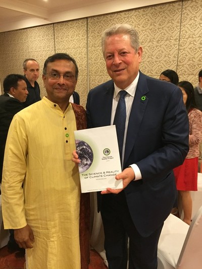 CB Ramkumar presenting Al Gore with his Climate Change workbook at the International Climate Change Training in Manila 2016, where Ram was a Mentor