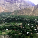 Hemmed in by gigantic Booni Zom (6,542 m) to the East and Hindukush Mountain Range to the West, Booni Town is located 85 kilometers to the north-east of district Chitral (Lower). Spread around 8 square kilometers, it is the headquarter of the newly established district Chitral Upper. <br /><br />Traditional hospitality marked by indigenous cultural values, peace, friendliness and care on the part of local communities and tourism service providers reinforced by its new status as headquarter of the freshly established district Chitral Upper, the town has grown in importance and reputation as an attractive tourists destination.   <br /><br />The organic kitchen gardens and cool orchards laden with a variety of fresh, delicious and juicy fruits i.e. apple, apricot, mulberry, strawberries (both wild and gardened), peaches, pears and grapes, Booni has a long-standing tradition of receiving and hosting tourists, particularly foreign tourists, who have had visited this remote mountain settlement for teaching in schools and carrying out cultural studies. <br /><br />Given its suitable launching points from Zani Pass, Shipishoon and Booni Zom and unobstructed landing spots coupled with the buoyancy of the ever-persisting thermals, the Town is dubbed as ‘Heaven for Paragliders’ and attracts reputed national and international paragliders every year. The world record of longest paragliding (non-stop 10 hours) from Birmoghlasht (district Lower Chitral) to Hunza valley (Gilgit Baltistan) was established in 2010 here in Chitral by Brad Sander, a reputed paraglider from the US. <br /><br />There are short and long duration natural treks here catering to the stamina and taste of different age groups. It is both refreshing and rewarding to climb up the Dono peak—a nose-touching steep rock right in front of the Town—that takes a full day for climbing and trekking. <br /><br />Atop the peak, one can have a panoramic view of the towering snow-capped mountains including the fabulous Terichmir Peak (7,708m) and Booni Zom in the surrounding. Shagram and Khot villages of Torkhow valley and Mastuj in the Byar region are clearly visible to the naked eyes from this point. A camera mounted with powerful lances, can greatly help to take take best pictures of the beautiful surrounding from this point on a cloudless day. <br /><br />There are clean and affordable village guesthouses besides the Motel of Pakistan Tourism Development Corporation (PTDC). Located in a vast and picturesque landscape with clean and airy rooms and gardens showcasing a variety of flowers, fruit bearing trees and well-maintained lawns carpeted with soft grasses, accommodation in PTDC offers true comfort for guests willing to take rest after long  and exhausting trekking, paragliding or cycling from Gilgit to Chitral and vice versa. <br /><br />Booni has a vast polo pitch where Free Style Polo is played by every weekend from early spring to late autumn. Young generation is passionate about keeping horses and adopting Free Style Polo as a hobby. This also offers thrilling opportunity for horseback riders. The reputed three-day Qaqlasht festival featuring free style polo organized here in the second week of April every year. It attracts large number of tourists—both local, national, and international.