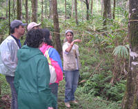 Sujata explains to guests the merits of shade-grown coffee