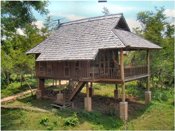2p - Bungalow design showing stilts, high wooden shingles roof, tall side windows with louvers and top roof opening.